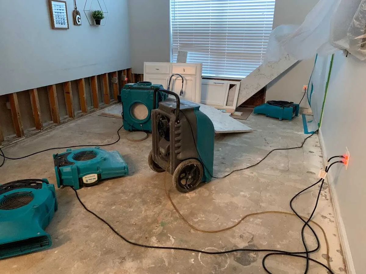 Dehumidifier in flood-cut room for Water Damage Restoration in Cheyenne